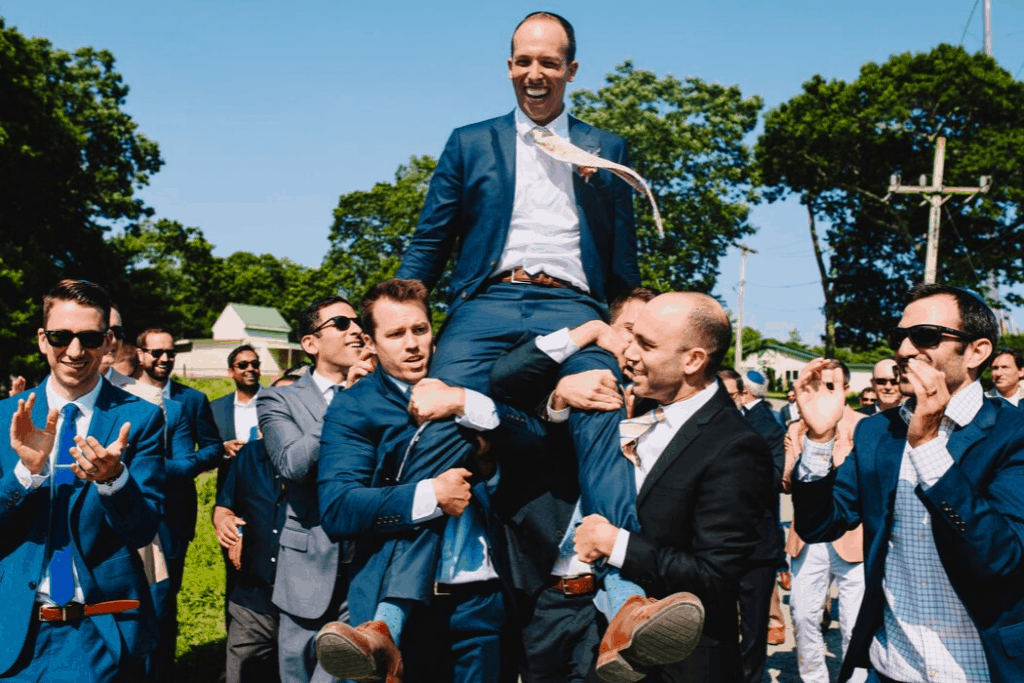 Zach on Shoulders of Groomsmen