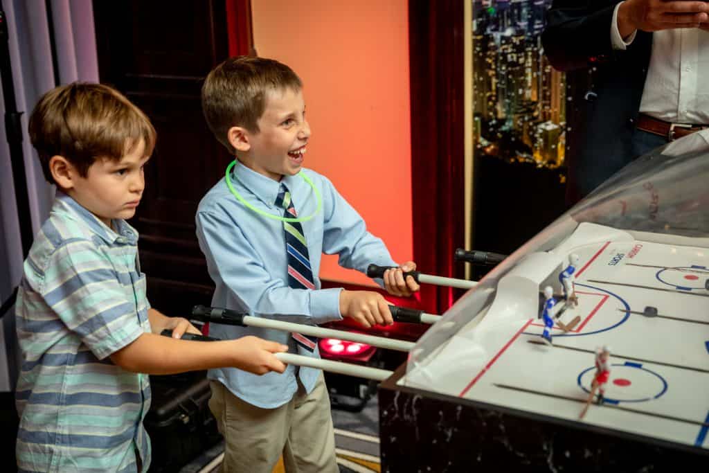 Bar Mitzvah Attendees Playing Air Hockey